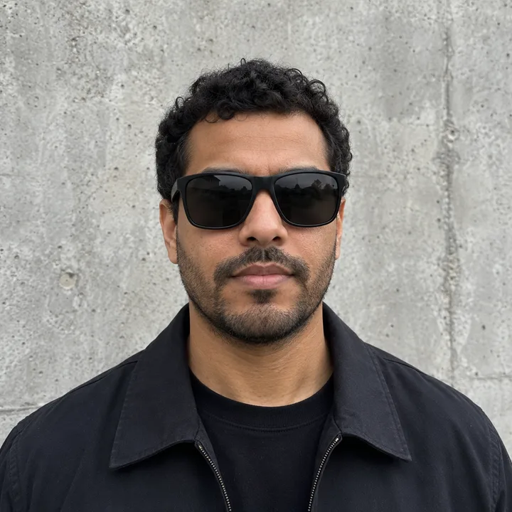 AI-generated portrait example: an adult wearing opaque sunglasses that hide both eyes